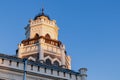 Close-up of an old building tower against a background of blue sky Royalty Free Stock Photo
