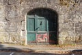 Close-up of an old carriage entrance door in the historical district of Figeac, France