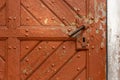 close-up of an old, church wooden door with a handle and keyhole. Royalty Free Stock Photo