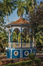 Close-up of an old colorful gazebo in the middle of verdant garden full of trees, in a sunny day at SÃÂ£o Manuel.