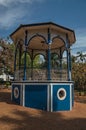 Close-up of old colorful gazebo in the middle of verdant garden full of trees, in a sunny day at SÃÂ£o Manuel.