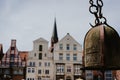 Close up of old Crane weight in front of historical building facade in Harbor Lueneburg, Lower Saxony,Germany Royalty Free Stock Photo