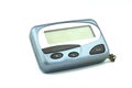 Close-up old a cyan metallic pager or beeper isolated with clipping path on white background. Royalty Free Stock Photo