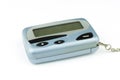 Close-up front a cyan metallic pager or beeper is put lying on white floor and background, isolated with clipping path Royalty Free Stock Photo