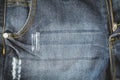 close up of old denim blue jean trousers texture with pocket background Royalty Free Stock Photo