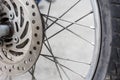Close up of Old Disc brake of  motorcycle wheels Royalty Free Stock Photo