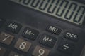 Close-up of an old dusty calculator. Electronic equipment for counting and calculations. Selective focus Royalty Free Stock Photo