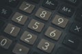 Close-up of an old dusty calculator. Electronic equipment for counting and calculations. Selective focus Royalty Free Stock Photo