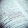 Close up of old English dictionary page with word Photographer. Royalty Free Stock Photo