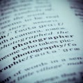 Close up of old English dictionary page with word Photographer. Royalty Free Stock Photo