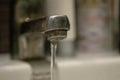 Close up old faucet with water drop background. Royalty Free Stock Photo