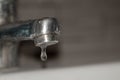 Close up old faucet with water drop background. Royalty Free Stock Photo