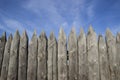 Close up on an old fence made of logs, Protective structure for the protection of a wooden fortress. Fence and strengthening of th