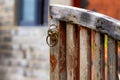 Close-up of an old fenced wooden door in rural China Royalty Free Stock Photo