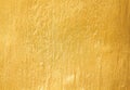 Old gold cement wall in rough patterns abstract texture for background Royalty Free Stock Photo