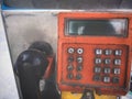 Close up Old Grungy Orange Public Payphone Royalty Free Stock Photo