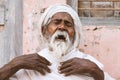 Close up of a old indian sadhu speak up sacred scriptures.