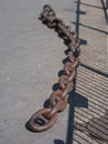Old iron dock chain still in situ at Canada Water, London, UK. Royalty Free Stock Photo