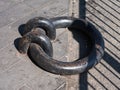 Close-up of an old iron dock ring. Royalty Free Stock Photo