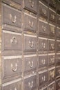 Close up of an old iron locker with small drawers