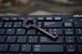 Close up old key and push-button the computer keyboard Royalty Free Stock Photo