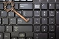 Close up old key and push-button the computer keyboard Royalty Free Stock Photo