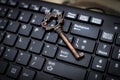 Close up old key and push-button the computer keyboard Royalty Free Stock Photo