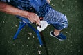 Close up of old lady hands holding a stick and protective mask outdoors. new normal Royalty Free Stock Photo