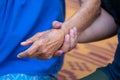 Close-up of the Old lady hands A man holding a grandmother's hand looks warm caring for the elderly in the family Royalty Free Stock Photo