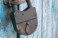 Close up of an old lock on a door. Hinged rusty large lock on the door Royalty Free Stock Photo