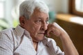 Sad grandfather put head on hand lost in thoughts Royalty Free Stock Photo