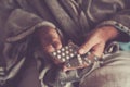 Close up of old man hands with mix of pills medicine to take to heal health. Concept of senior people health lifestyle with Royalty Free Stock Photo