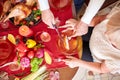 Close-up old man serving roasted turkey on a table background. Thanksgiving dinner. Traditional festive food concept. Royalty Free Stock Photo