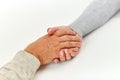 Close up of old man and young woman holding hands Royalty Free Stock Photo