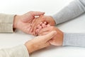 Close up of old man and young woman holding hands Royalty Free Stock Photo