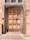 Close up of old medieval brown wooden retro door closed