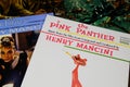 Close up of old movie soundtrack vinyl record album covers with focus Henry Mancini Pink Panther