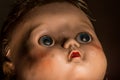 Close up of old neglected and unloved plastic doll . Royalty Free Stock Photo