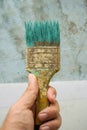 Old paint brush on man hand Royalty Free Stock Photo