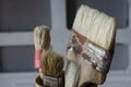 Close-up of old paint brushes standing upright