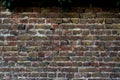 Close up of an old red orange brown worn and weathered brick wall, clinker bricks. Brick texture Royalty Free Stock Photo