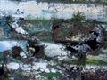 Close up of an old rusted peeling steel with layers of peeling silver and green paint Royalty Free Stock Photo