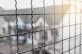 Close up of old and rusty cage metal net with blurred background