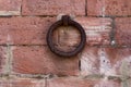 Close up of old rusty iron ring on a red brick wall Royalty Free Stock Photo