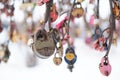 close up old rusty locks heart shaped on wire rope. Love lock on the bridge. tradition of hanging a barn lock on the Royalty Free Stock Photo