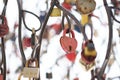 close up old rusty locks heart shaped on wire rope. Love lock on the bridge. tradition of hanging a barn lock on the