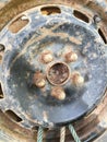 Old rusty metal alloy wheel car Royalty Free Stock Photo