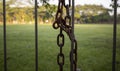 Close up of an old rusty metal padlock and chain, in shalow focus Royalty Free Stock Photo