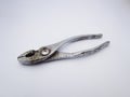 close up old rusty silver metallic closed pliers