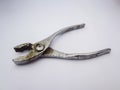 close up old rusty silver metallic opened pliers